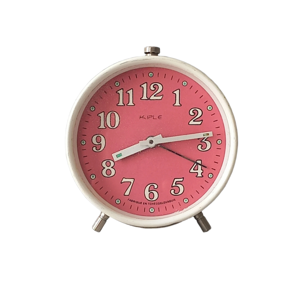 A vintage alarm clock in an eye-catching white and pink color scheme. This old clock is in working condition including the alarm and has a nice soothing ticking sound too. A great piece of European history from the former country of Czechoslovakia.

In summary, a nice vintage alarm clock!