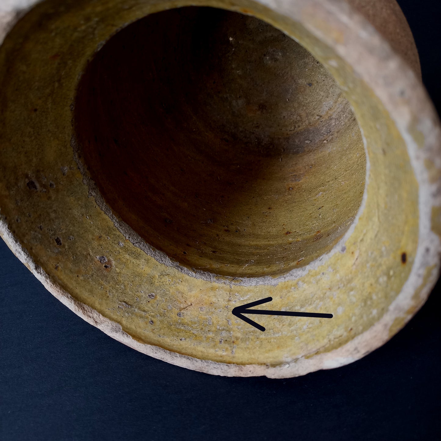 Small rustic vintage pottery jug with ochre glazed interior from France