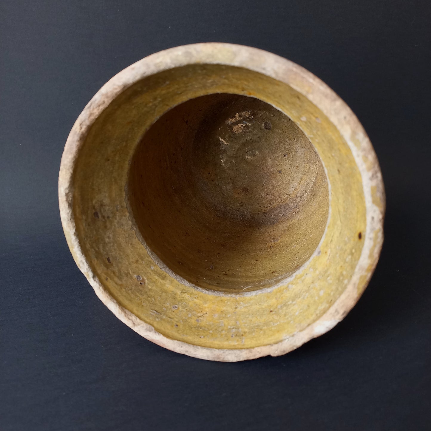 Small rustic vintage pottery jug with ochre glazed interior from France