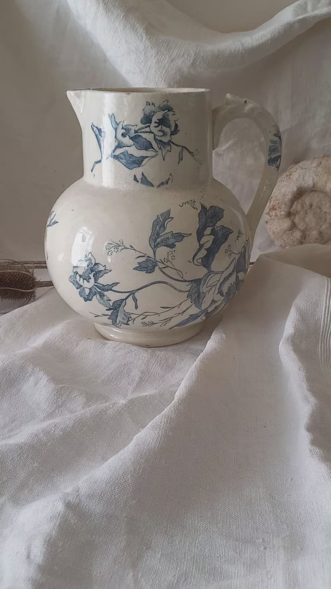 A large and beautiful French antique ironstone jug in a lovely aged white with blue floral transfer pattern. This wonderful piece of ironstone history has a super patina of age that gives it that look we all admire.