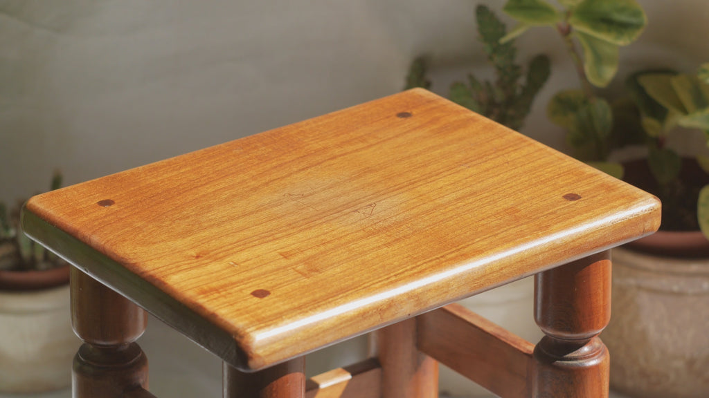 A handsome vintage French wooden stool in a lovely shade of honey-coloured brown. This old stool is very solid and would make a great plant stand (we currently use one on our desk as a plant stand and it looks great!) and many other decorative possibilities.