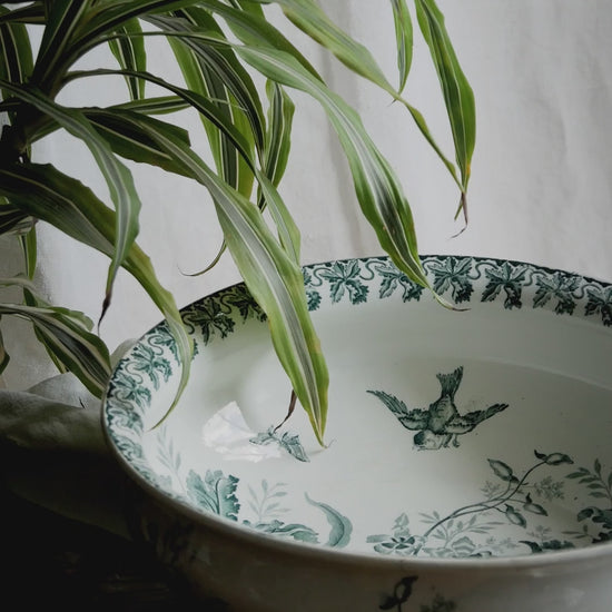A French antique ironstone jug, basin and soap dish, printed in a soft teal-green bird-and-floral pattern. 