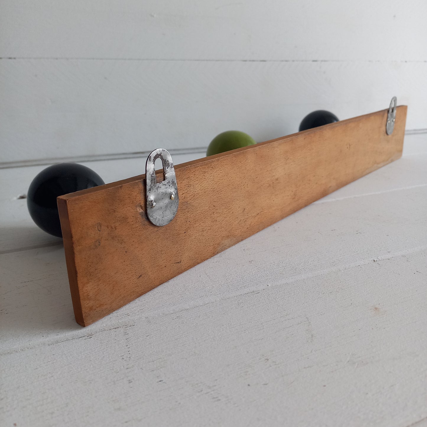 Vintage wooden coat rack with green and black pegs from France, retro wall mounted coat hanger