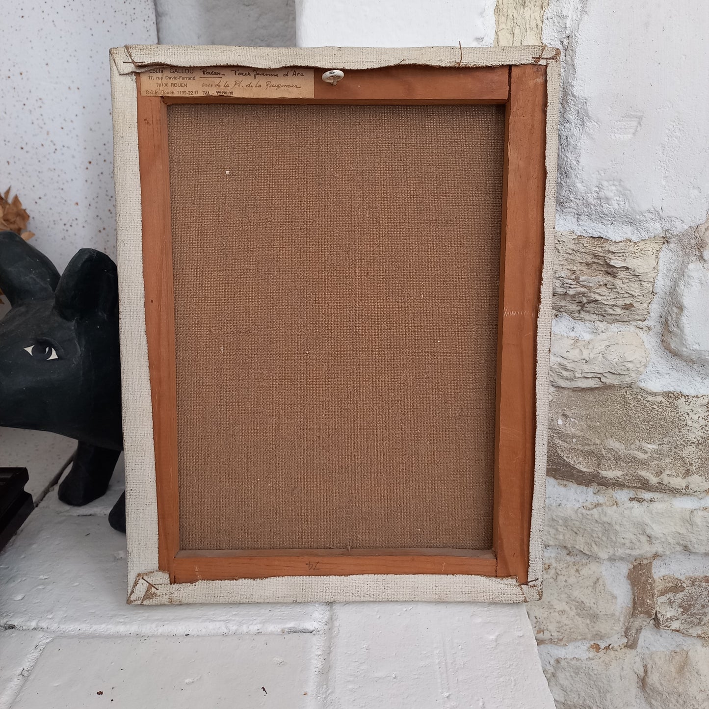 Vintage painting of a cityscape on a plain wall