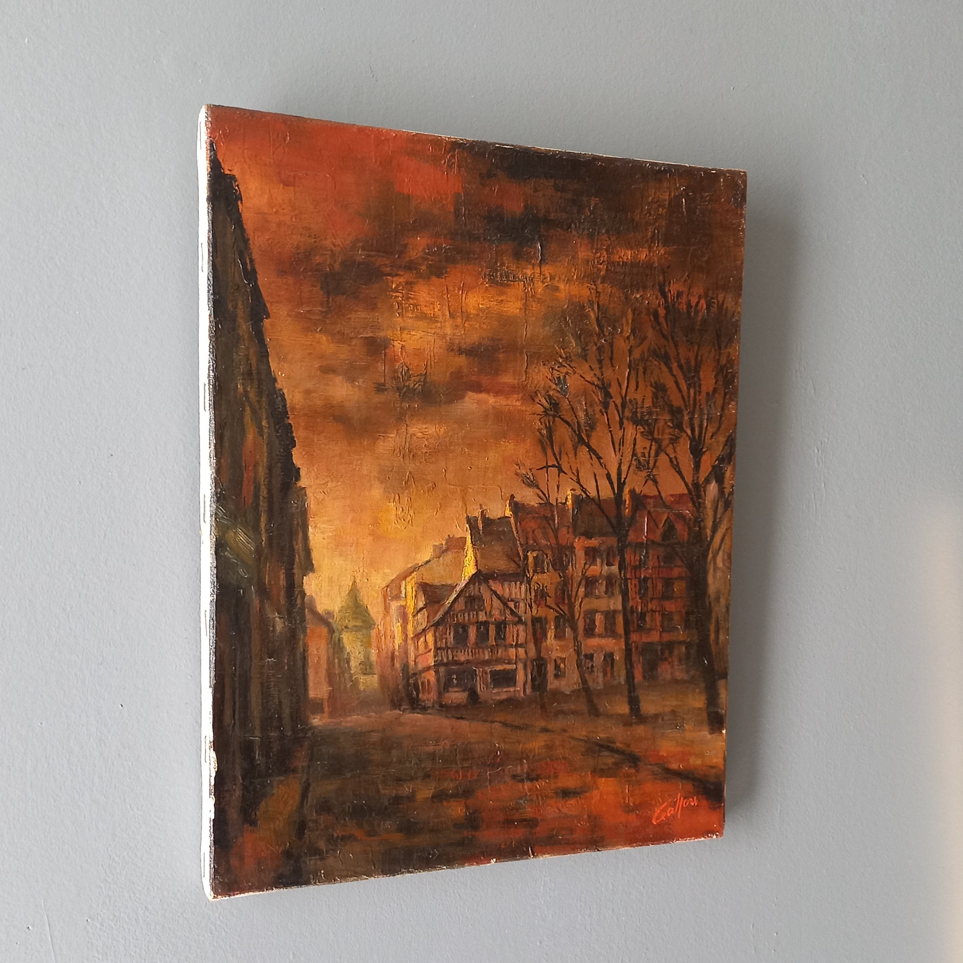 Painting of a cityscape with buildings and trees on a gray background