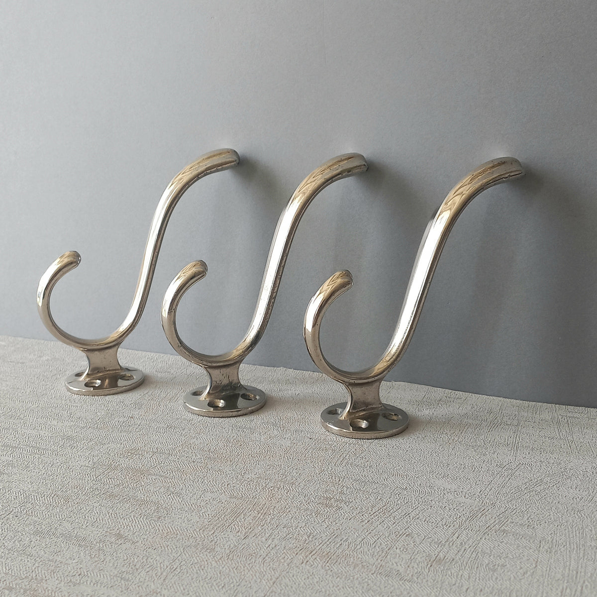 3 x French vintage silver coloured metal coat hooks in used sturdy used condition. Good for coat storage, dog leads, or maybe in the kitchen or bathroom for towels.
Circa. 1930s/1950s.