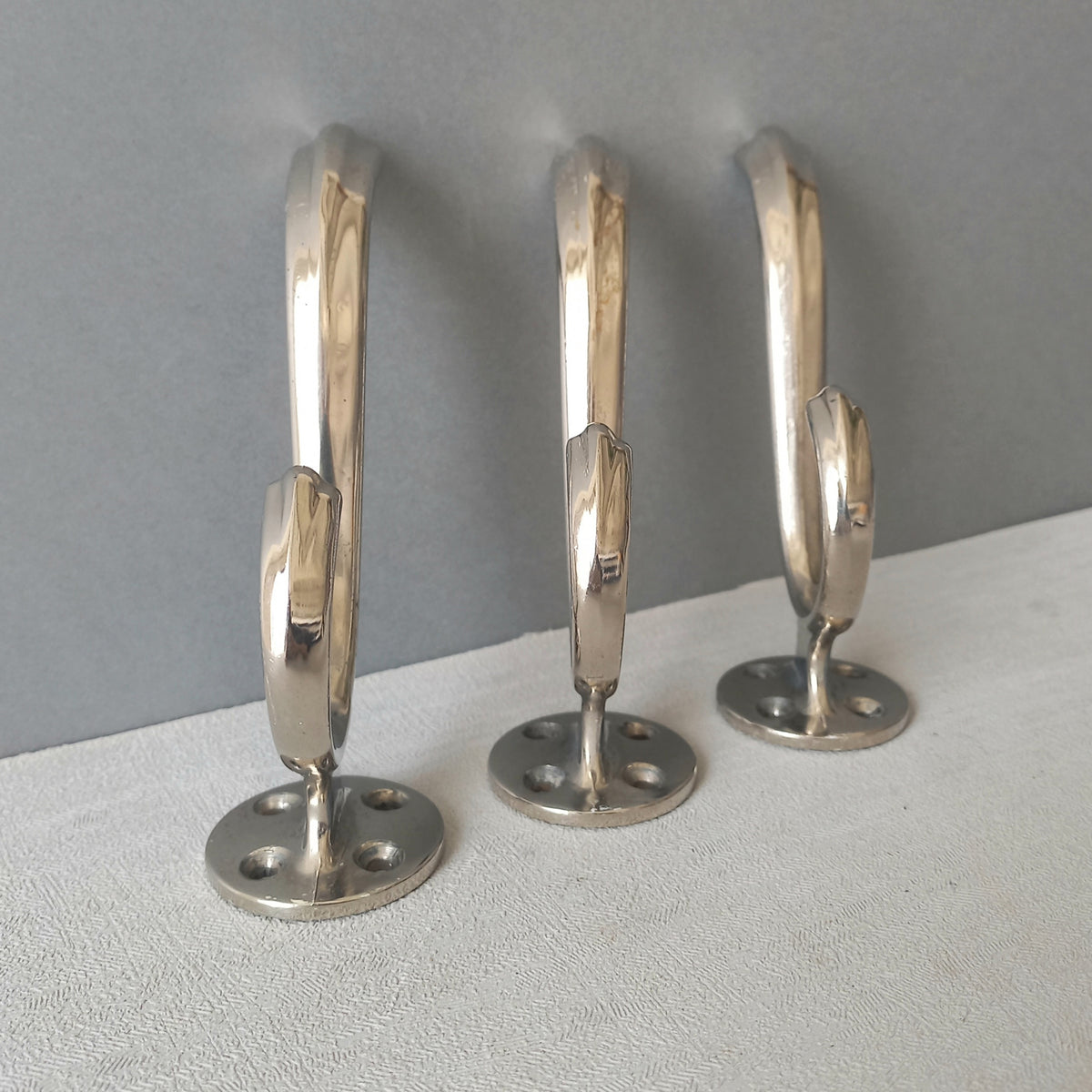3 x French vintage silver coloured metal coat hooks in used sturdy used condition. Good for coat storage, dog leads, or maybe in the kitchen or bathroom for towels.
Circa. 1930s/1950s.