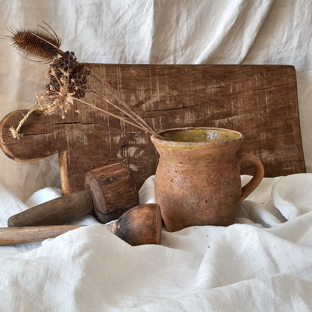 A little antique stoneware jug with a glazed interior in a wonderful shade of ochre, so rustic! This piece of pottery has aged beautifully and with its uneven worn edges and earthy rough texture it's perfect for a rustic, country or farmhouse interior.