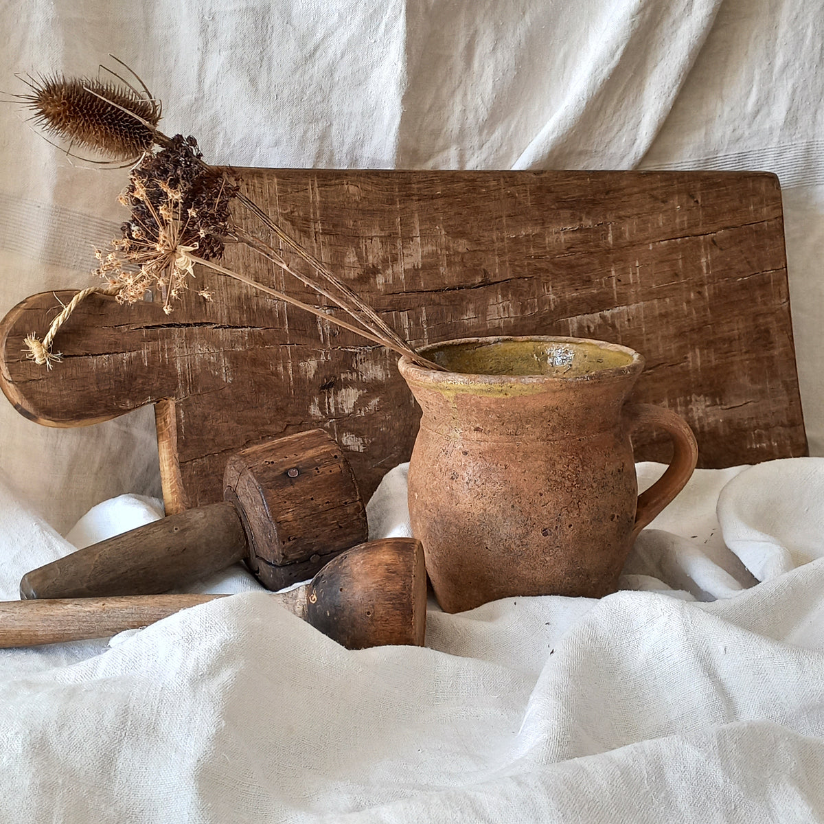 A little antique stoneware jug with a glazed interior in a wonderful shade of ochre, so rustic! This piece of pottery has aged beautifully and with its uneven worn edges and earthy rough texture it's perfect for a rustic, country or farmhouse interior.
