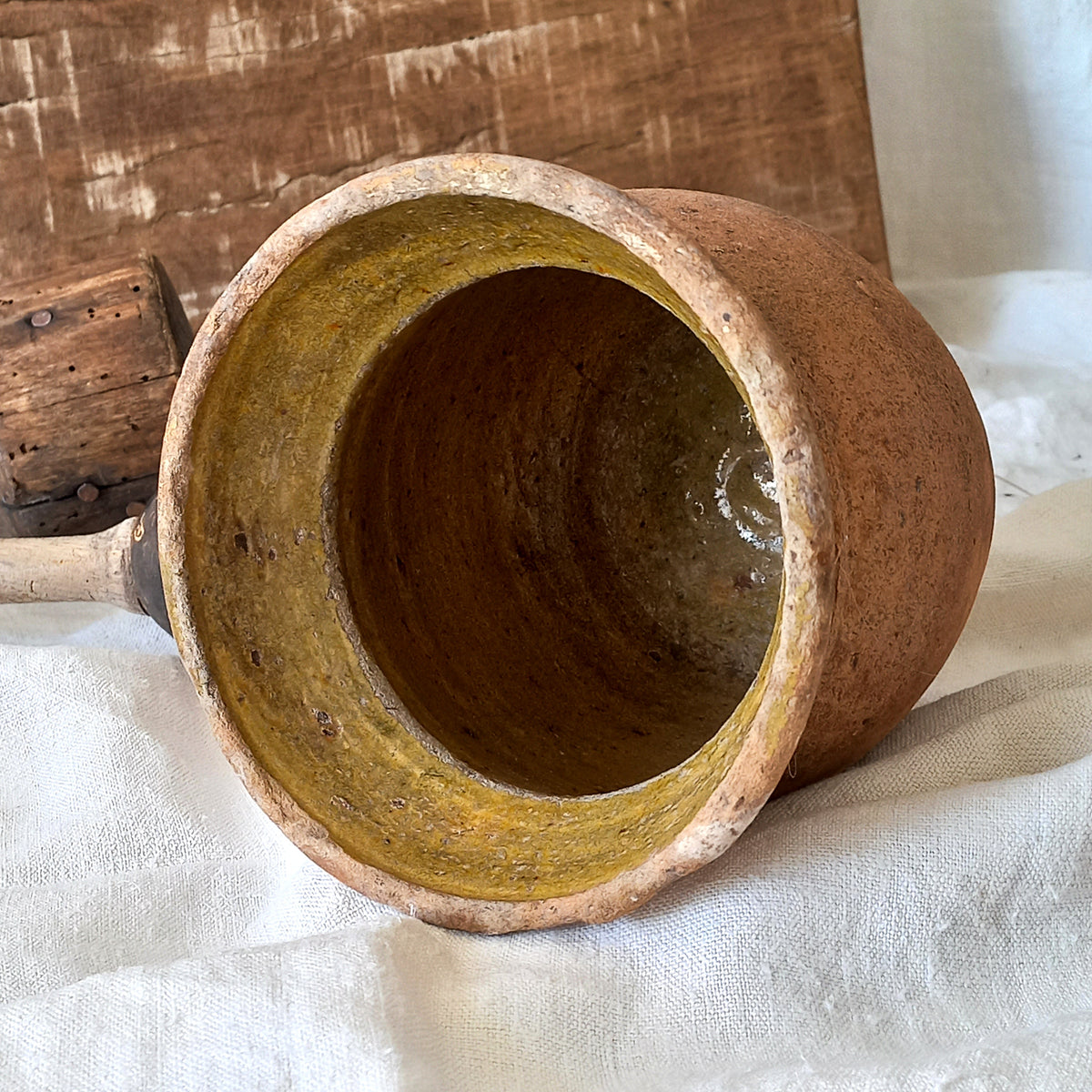 A little antique stoneware jug with a glazed interior in a wonderful shade of ochre, so rustic! This piece of pottery has aged beautifully and with its uneven worn edges and earthy rough texture it's perfect for a rustic, country or farmhouse interior.