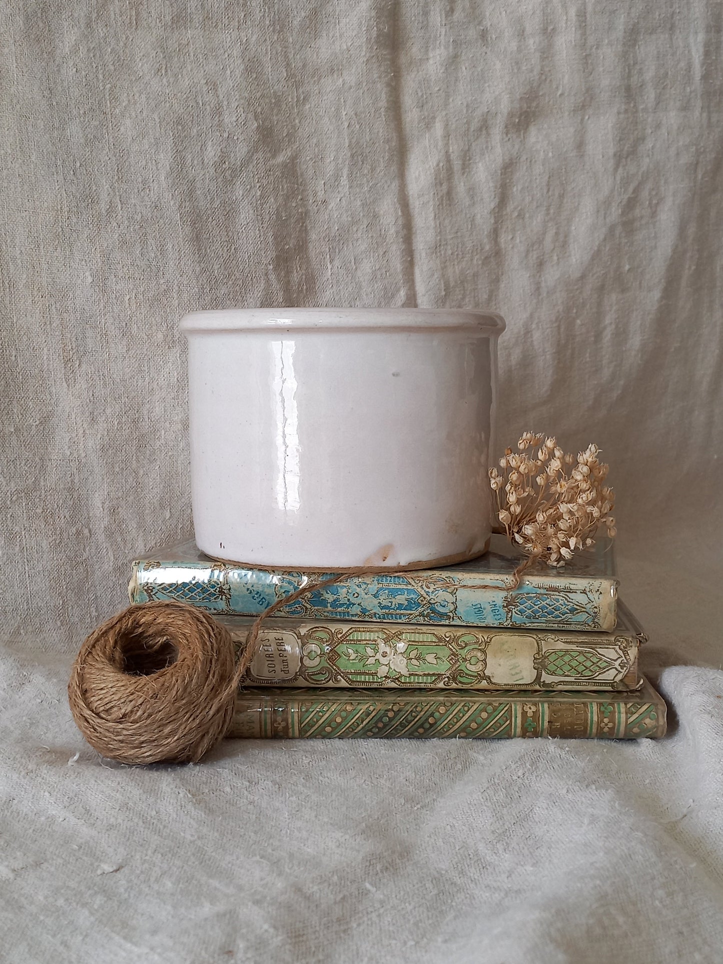 Antique jam pot on a textured surface