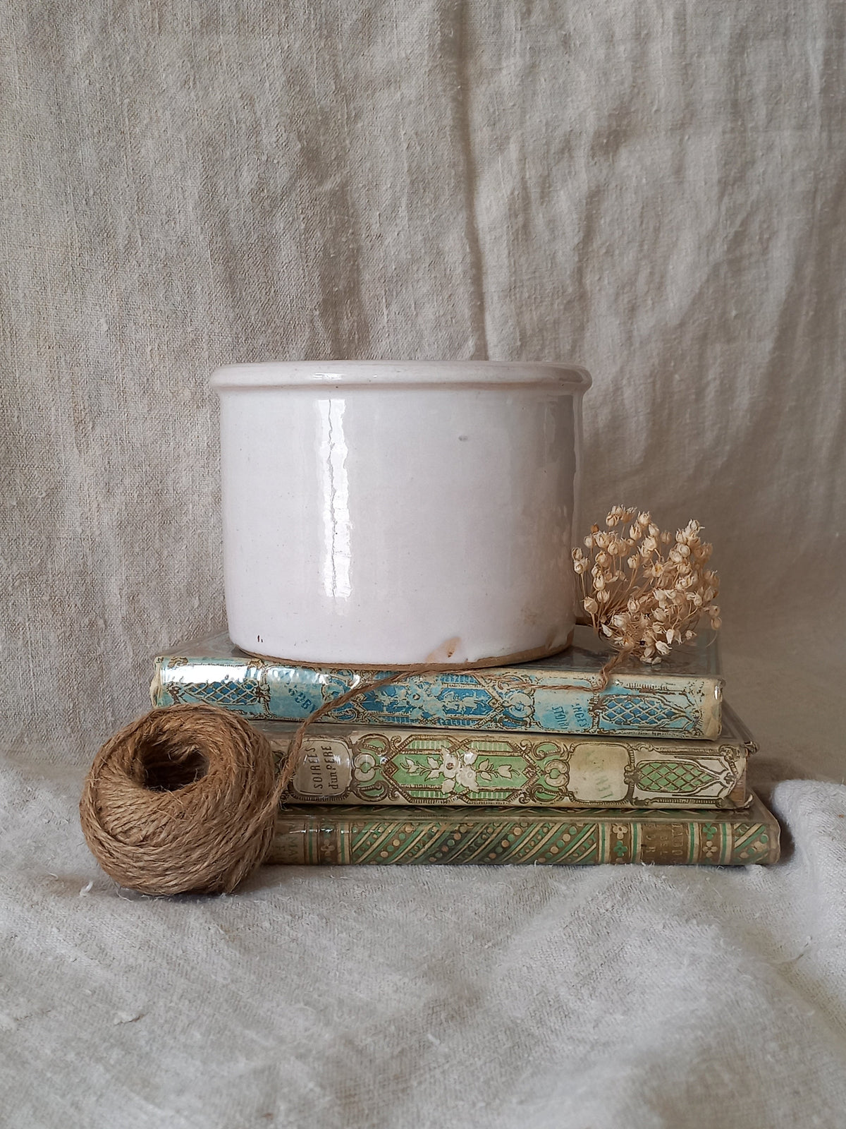 Antique jam pot on a textured surface