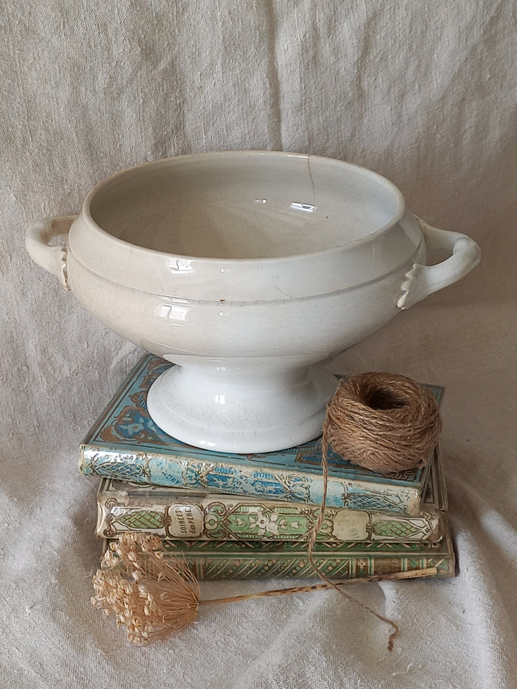 White ceramic bowl with a textured surface on a light stone surface
