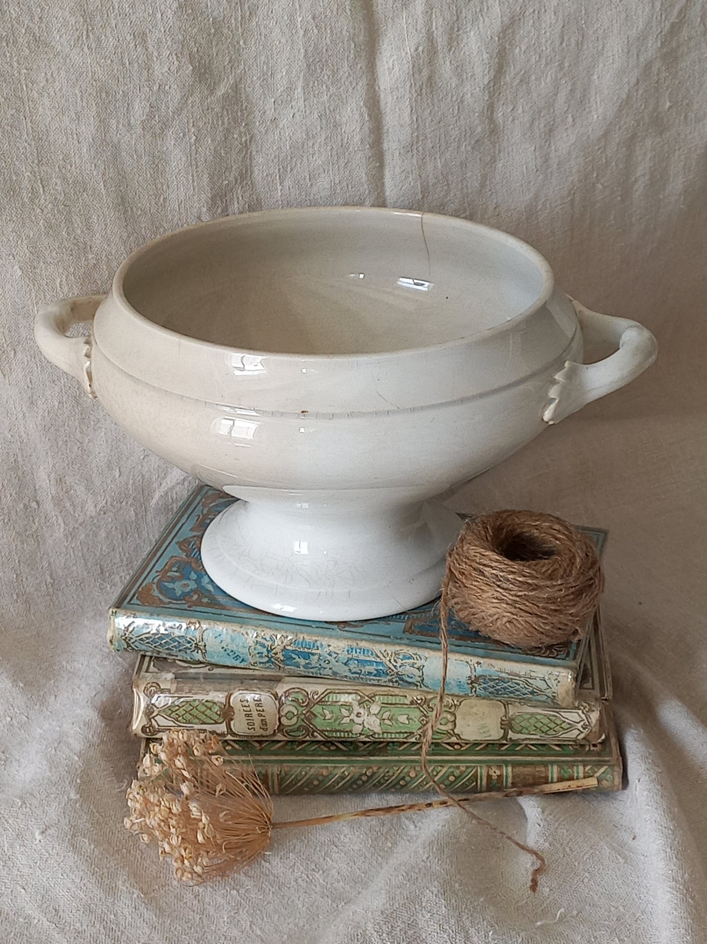 White ceramic bowl with a textured surface on a light stone surface