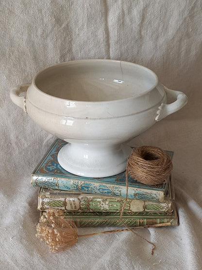White ceramic bowl with a textured surface on a light stone surface