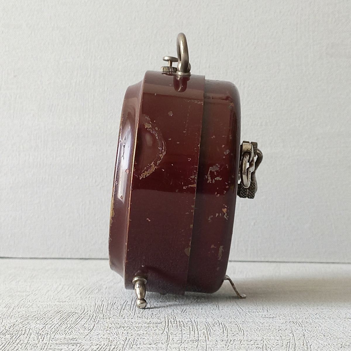 A handsome little vintage alarm clock by premier French manufacturer, Jaz.

This wonderful little clock is in semi-working condition including the alarm, although I should note that being an old time piece dating from the pre-1940 period he's temperamental and sometimes will just stop working, although all that's needed is a gentle shake from side to side and he will once more begin to tick - sometimes you might have to repeat this and have patience with him.