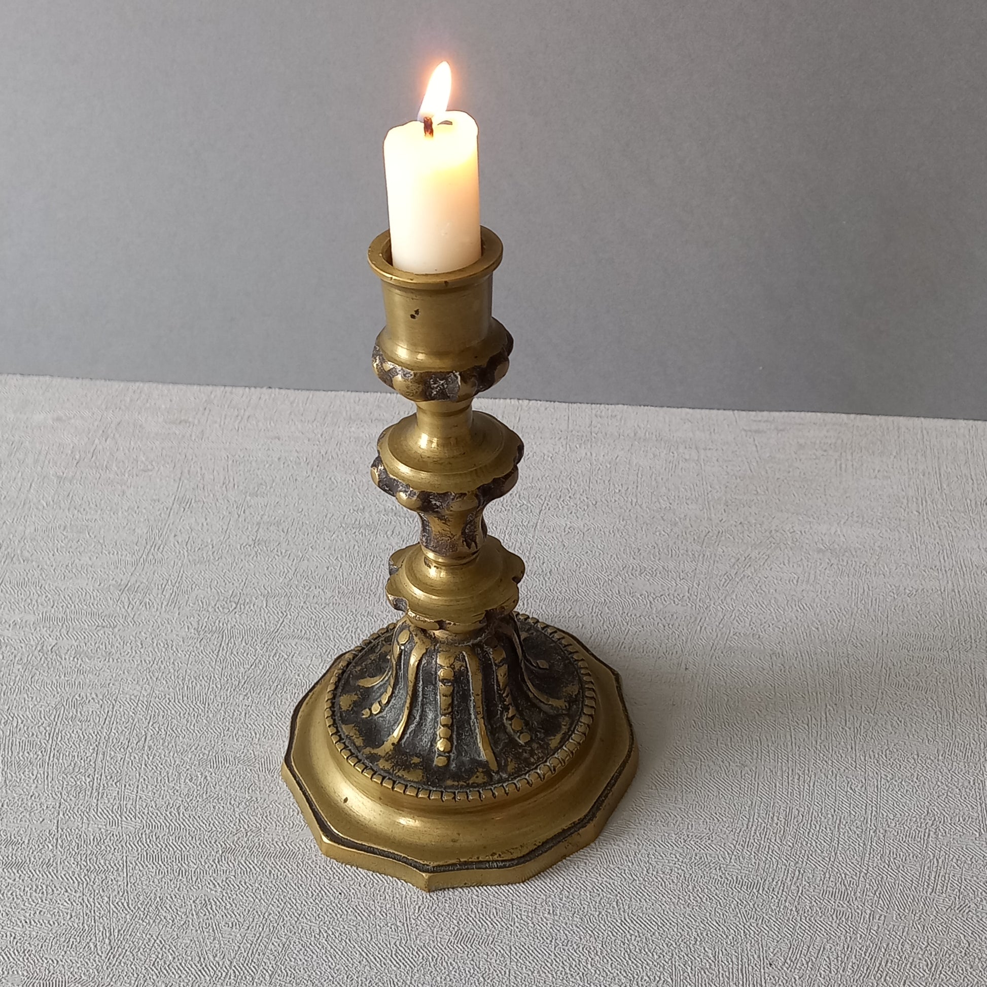 Small French vintage decorative brass bronze candle holder, a heavy piece for its size. Makes a very nice piece of practical home decor or is perfect as a vintage gift.