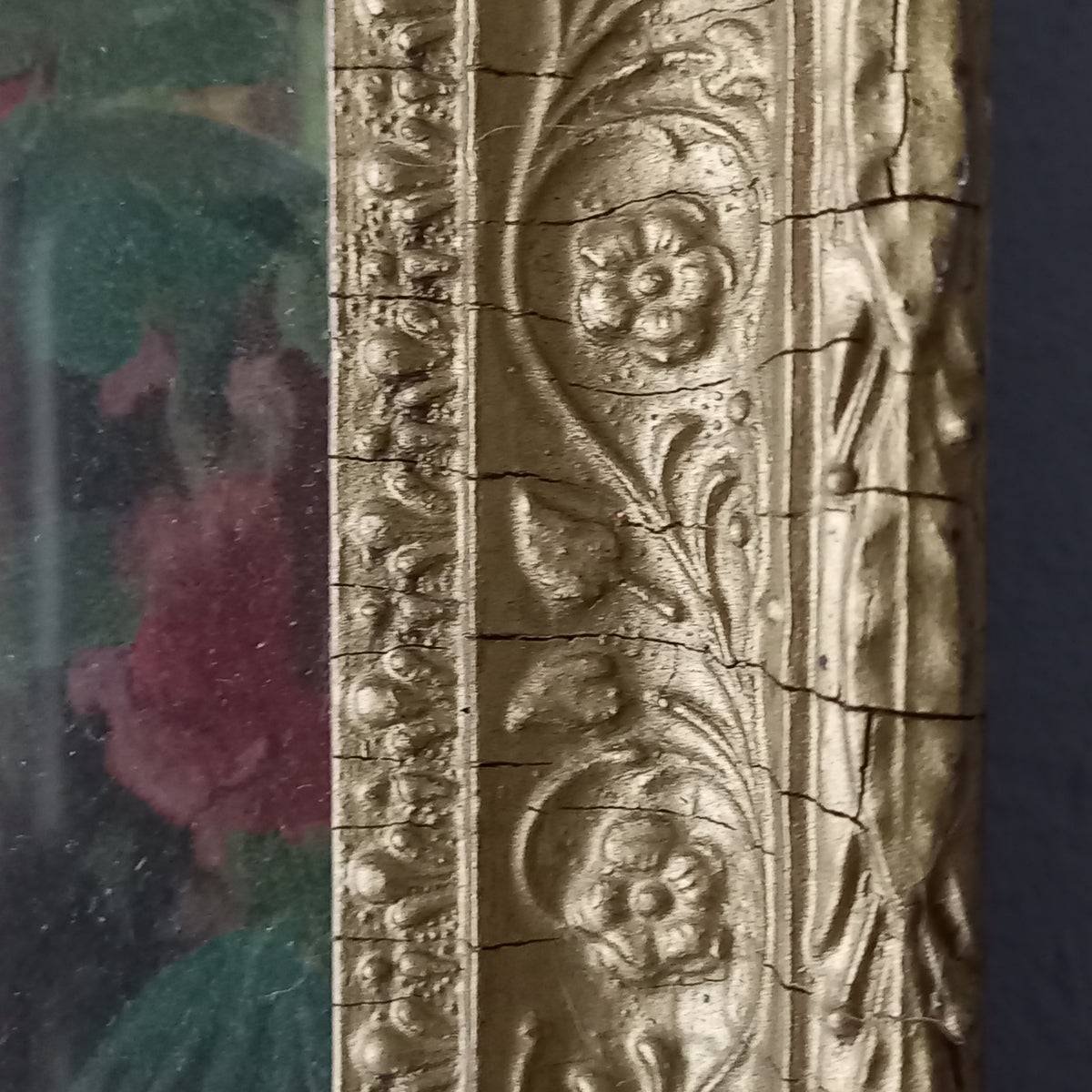 Decorative ornate frame with floral patterns on a dark background
