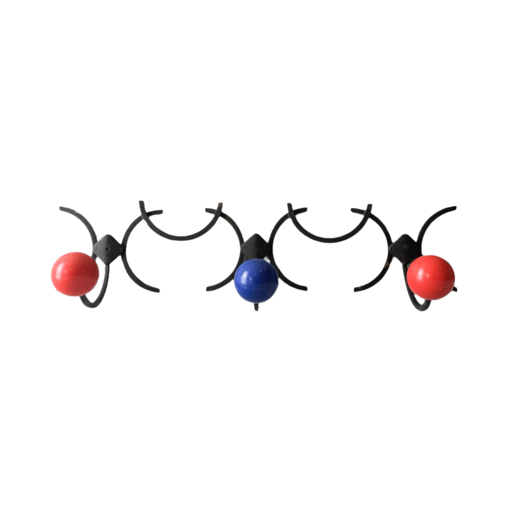 An original French vintage mid-century 'atomic' coat rack, a rare find these days and a wonderful piece of practical home decor. The black frame-work that holds the coloured pegs/balls is made from strong cast iron and there are two screw holes so that you can immediately fix the coat rack to your wall.