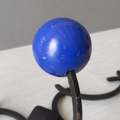 An original French vintage mid-century 'atomic' coat rack, a rare find these days and a wonderful piece of practical home decor. The black frame-work that holds the coloured pegs/balls is made from strong cast iron and there are two screw holes so that you can immediately fix the coat rack to your wall.