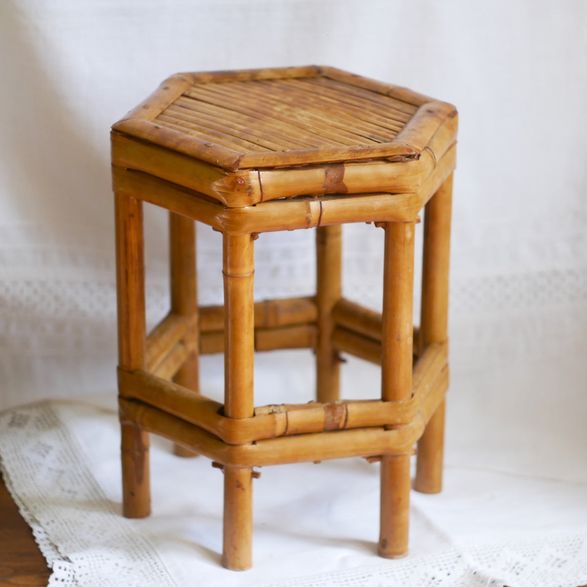 An attractive vintage bamboo pedestal which makes a wonderful plant stand. The pedestal is both solid and sturdy and can be used for many decorative purposes such as displaying plants, ornaments, dolls, etc.