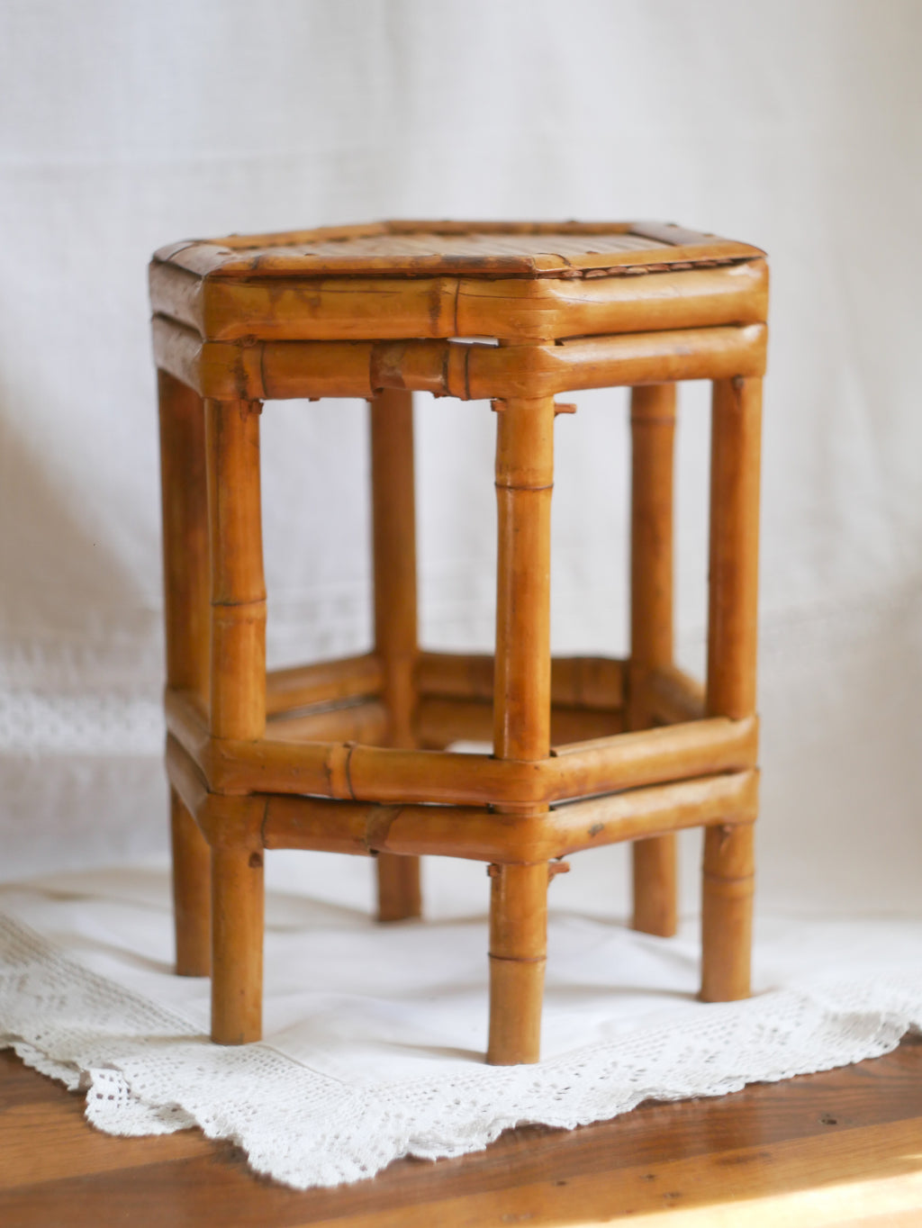 An attractive vintage bamboo pedestal which makes a wonderful plant stand. The pedestal is both solid and sturdy and can be used for many decorative purposes such as displaying plants, ornaments, dolls, etc.