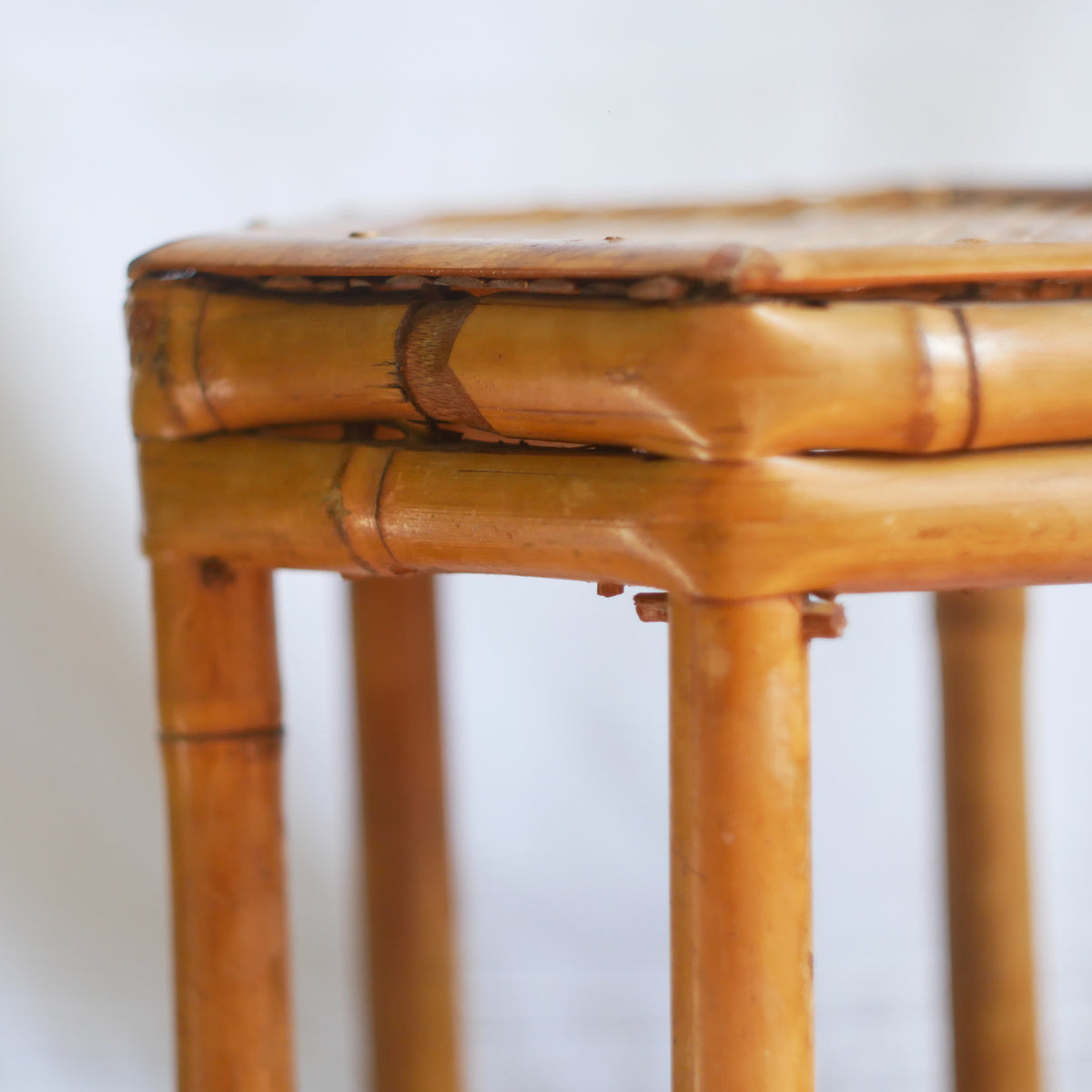 An attractive vintage bamboo pedestal which makes a wonderful plant stand. The pedestal is both solid and sturdy and can be used for many decorative purposes such as displaying plants, ornaments, dolls, etc.