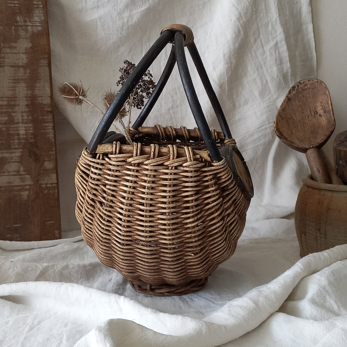 A vintage wicker shopping basket with a small wooden panel on each side with hand-painted fruit - so pretty!

This hand-made piece is full of rustic charm and offers many decorative possibilities to any interior, particularly those of a country, rustic or farmhouse nature.
