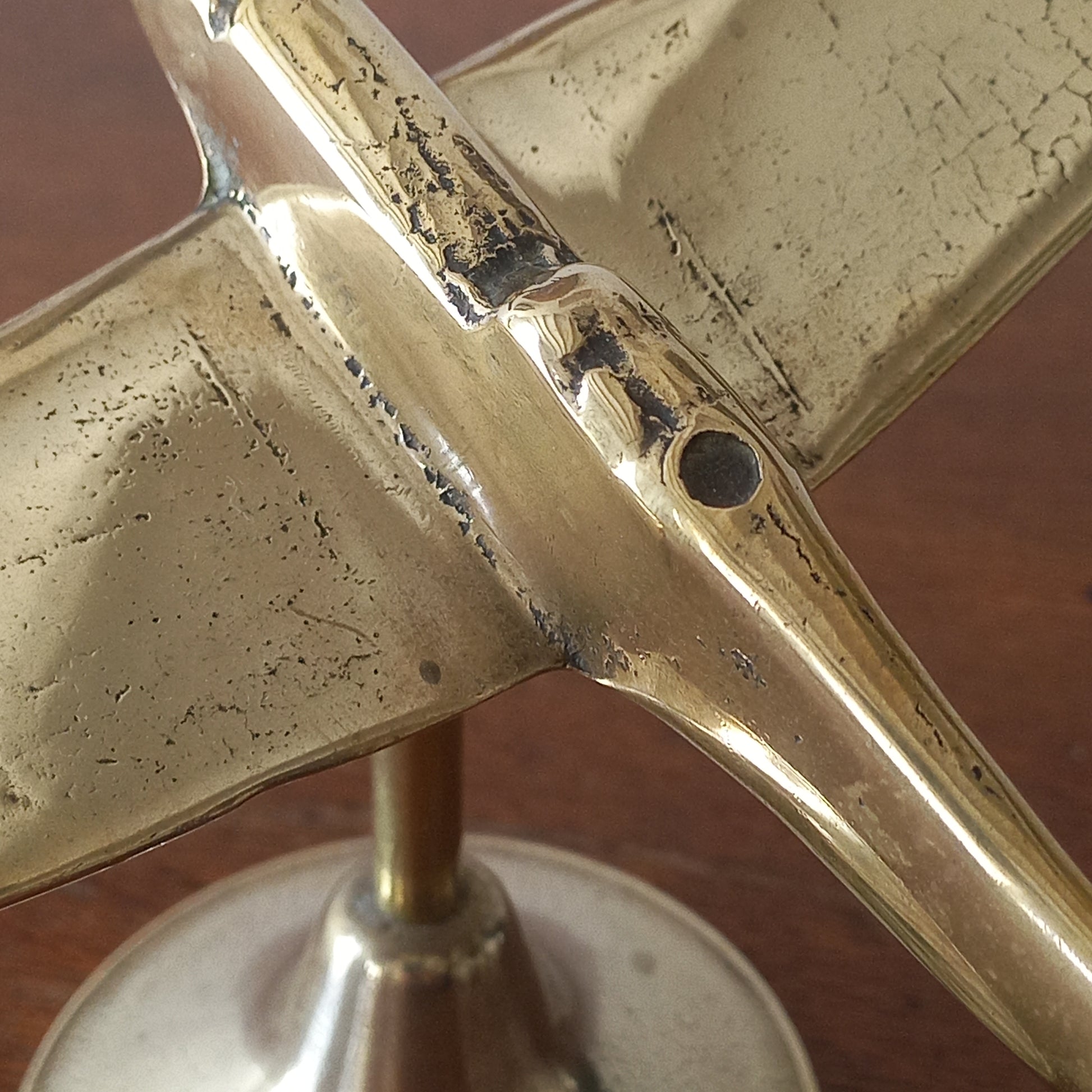 Close-up of a brass object with a textured surface