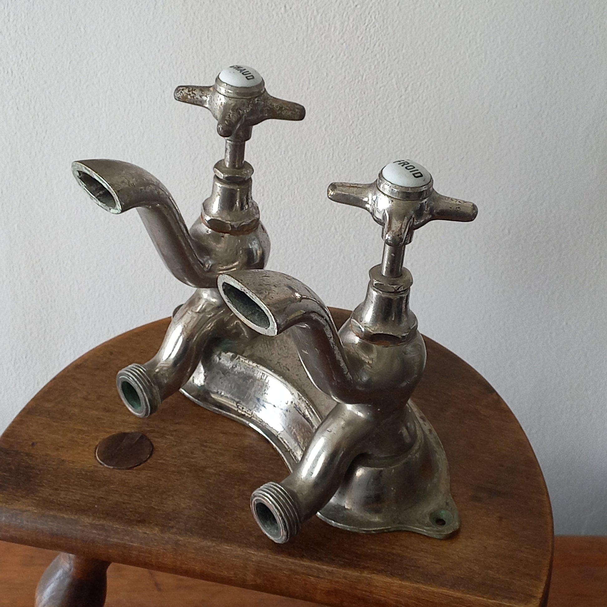 Vintage metal faucet on a wooden background
