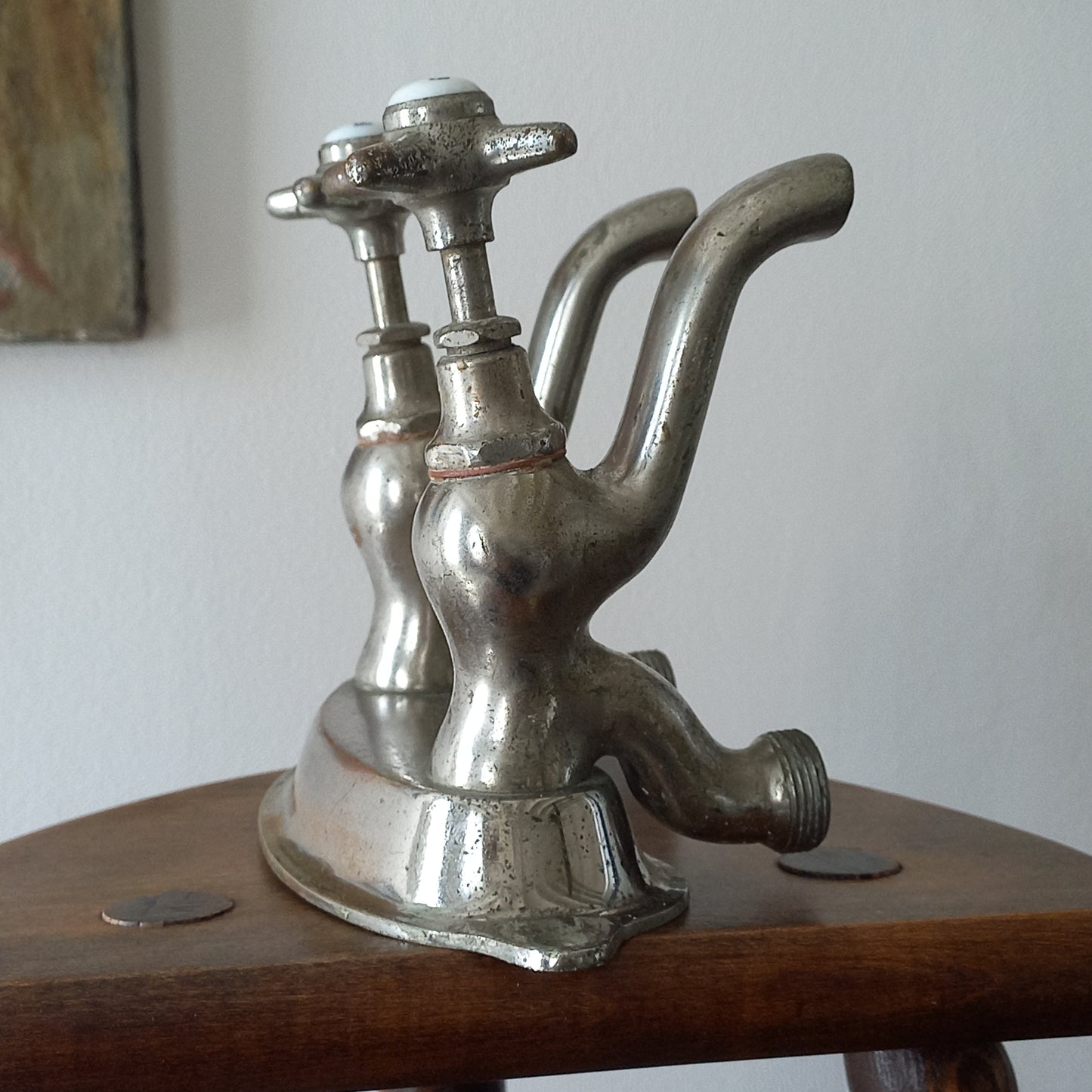 Vintage metal faucet on a wooden background