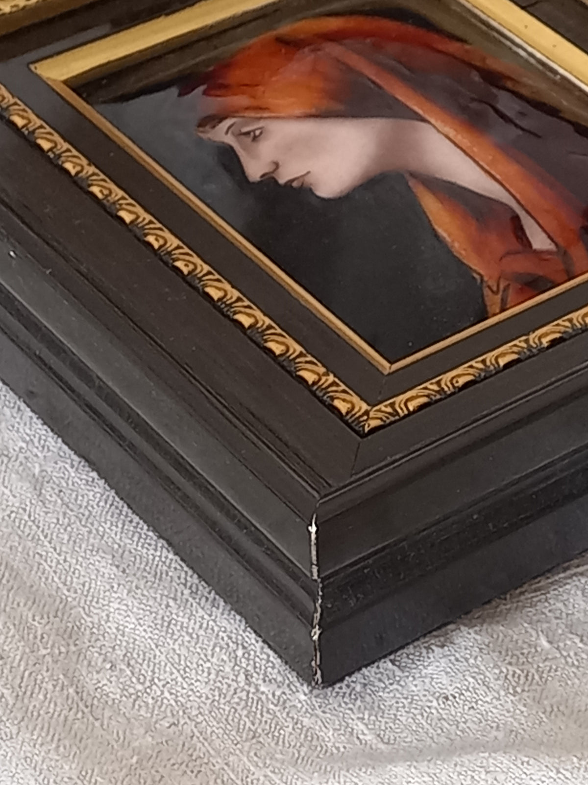 A French vintage religious enamel Saint Fabiola portrait painting by Limoges of France. The religious figure has been hand-painted in enamels on copper and signed by the artist. The art is presented in a dark brown frame with a label to the rear that tells us it's a genuine hand-made enamel artwork.