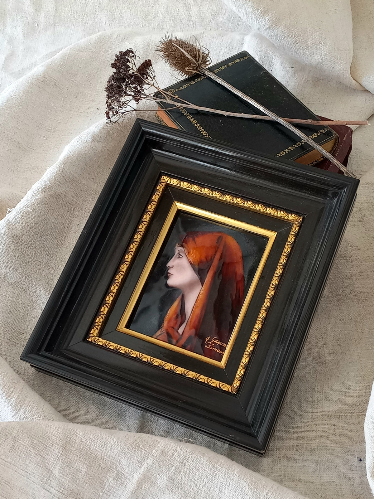 A French vintage religious enamel Saint Fabiola portrait painting by Limoges of France. The religious figure has been hand-painted in enamels on copper and signed by the artist. The art is presented in a dark brown frame with a label to the rear that tells us it's a genuine hand-made enamel artwork.