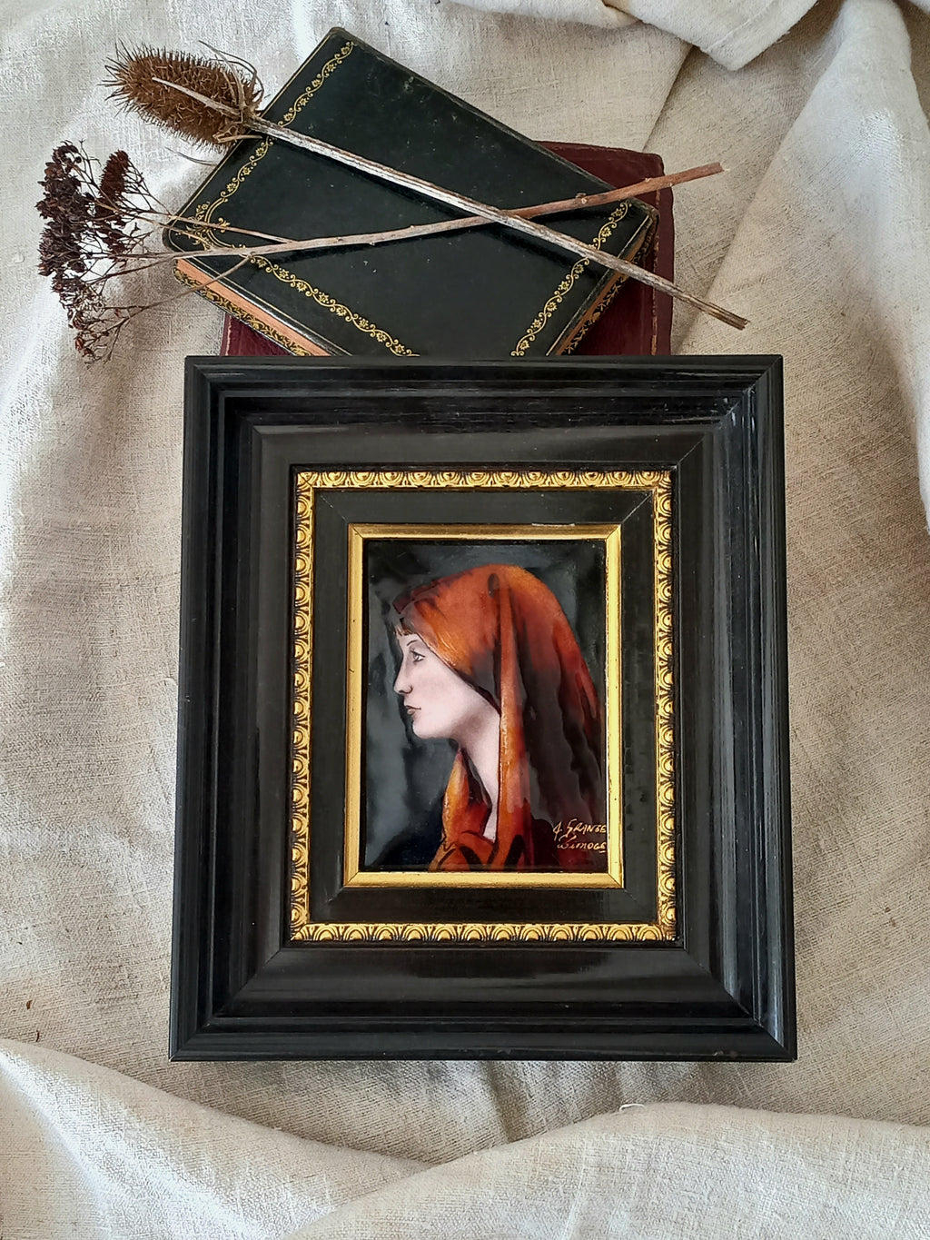 A French vintage religious enamel Saint Fabiola portrait painting by Limoges of France. The religious figure has been hand-painted in enamels on copper and signed by the artist. The art is presented in a dark brown frame with a label to the rear that tells us it's a genuine hand-made enamel artwork.