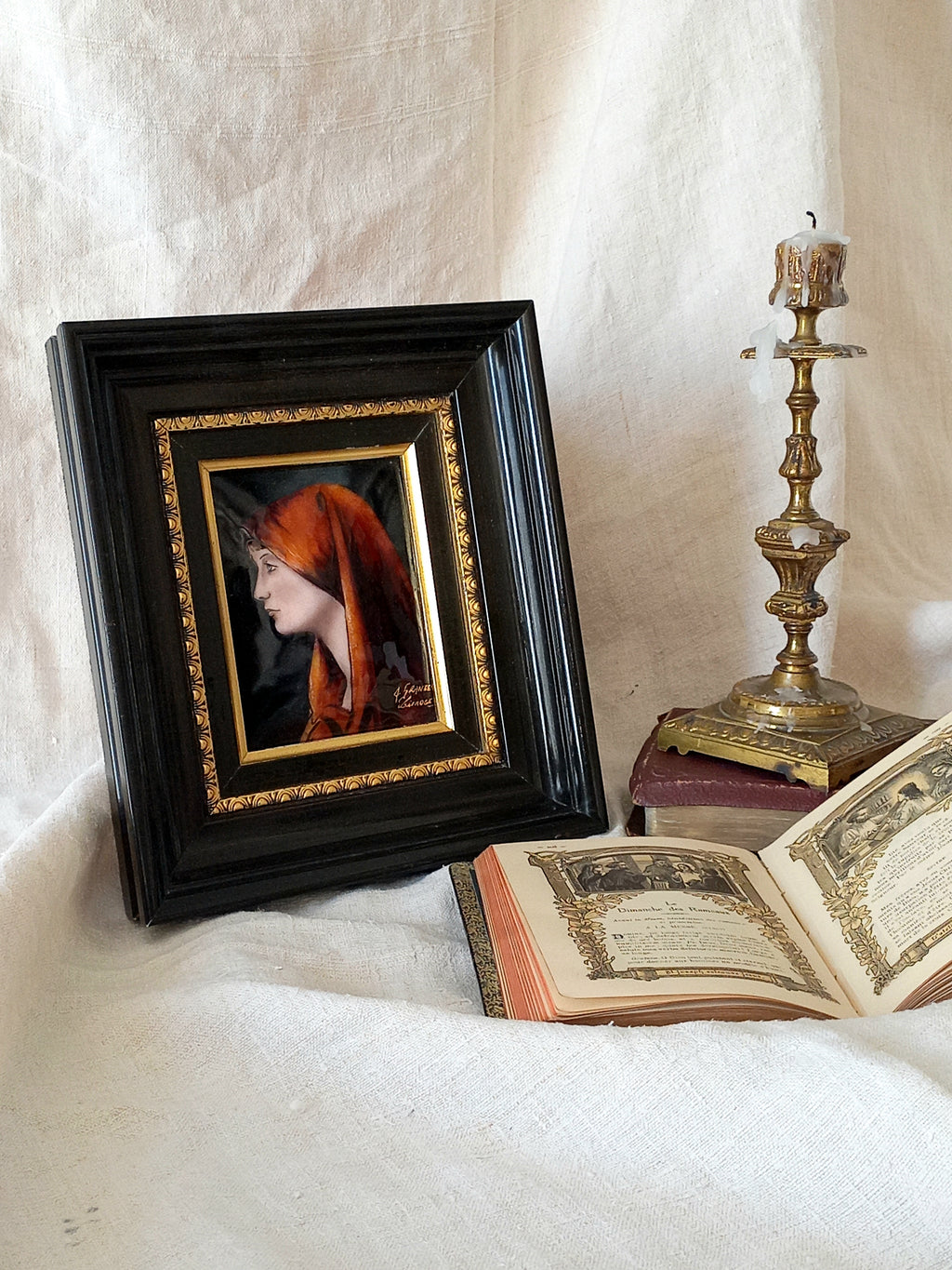 A French vintage religious enamel Saint Fabiola portrait painting by Limoges of France. The religious figure has been hand-painted in enamels on copper and signed by the artist. The art is presented in a dark brown frame with a label to the rear that tells us it's a genuine hand-made enamel artwork.