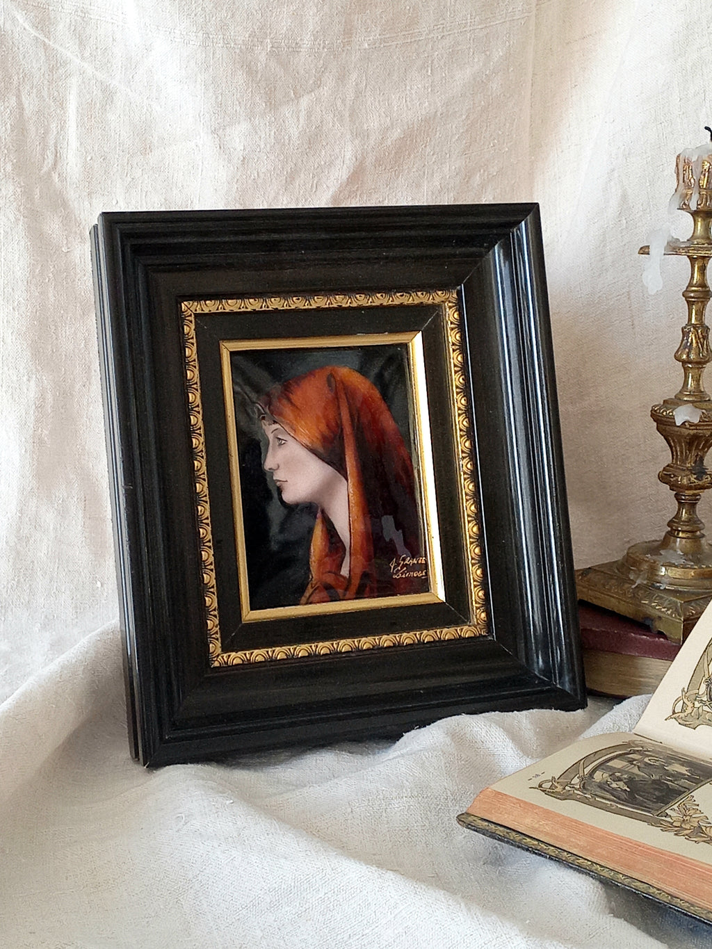 A French vintage religious enamel Saint Fabiola portrait painting by Limoges of France. The religious figure has been hand-painted in enamels on copper and signed by the artist. The art is presented in a dark brown frame with a label to the rear that tells us it's a genuine hand-made enamel artwork.