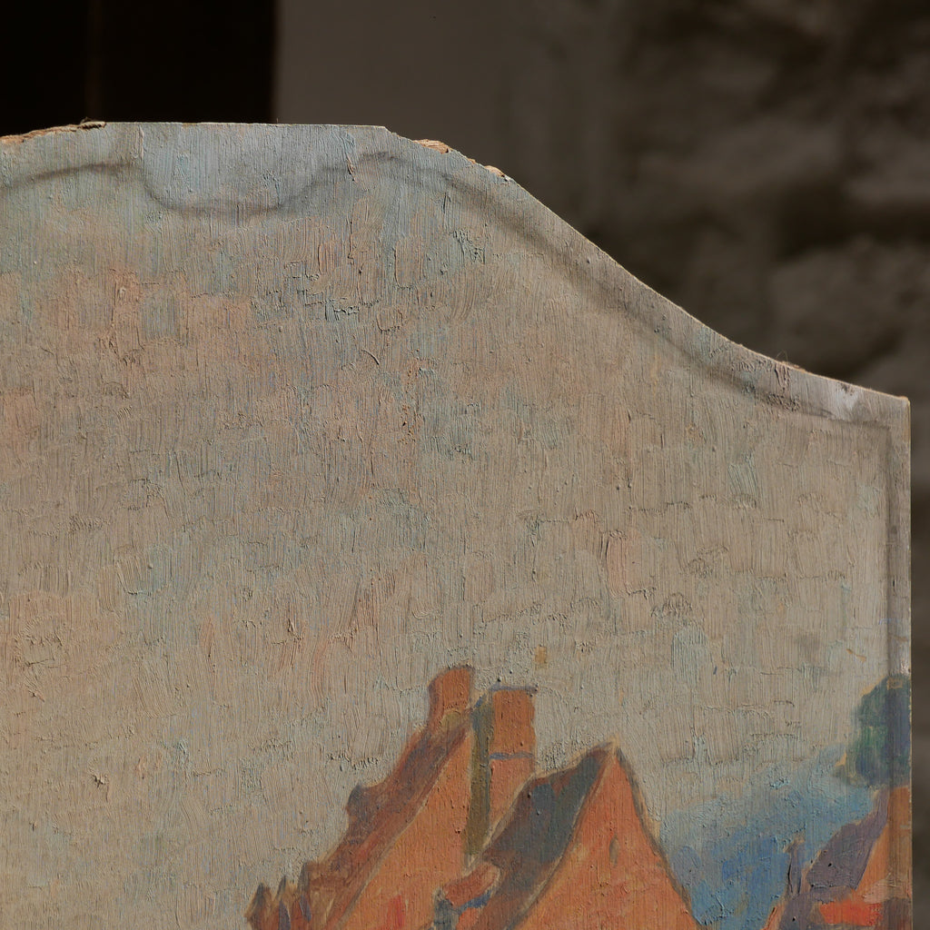An original vintage oil painting depicting a village on the banks of a large river. It looks similar to the Rhine River Danube in Germany, and with the large hills/mountains in the background maybe the Black Forest, although it could be many places in Europe and perhaps even in France where we purchased this wonderful piece of original art on wooden board.