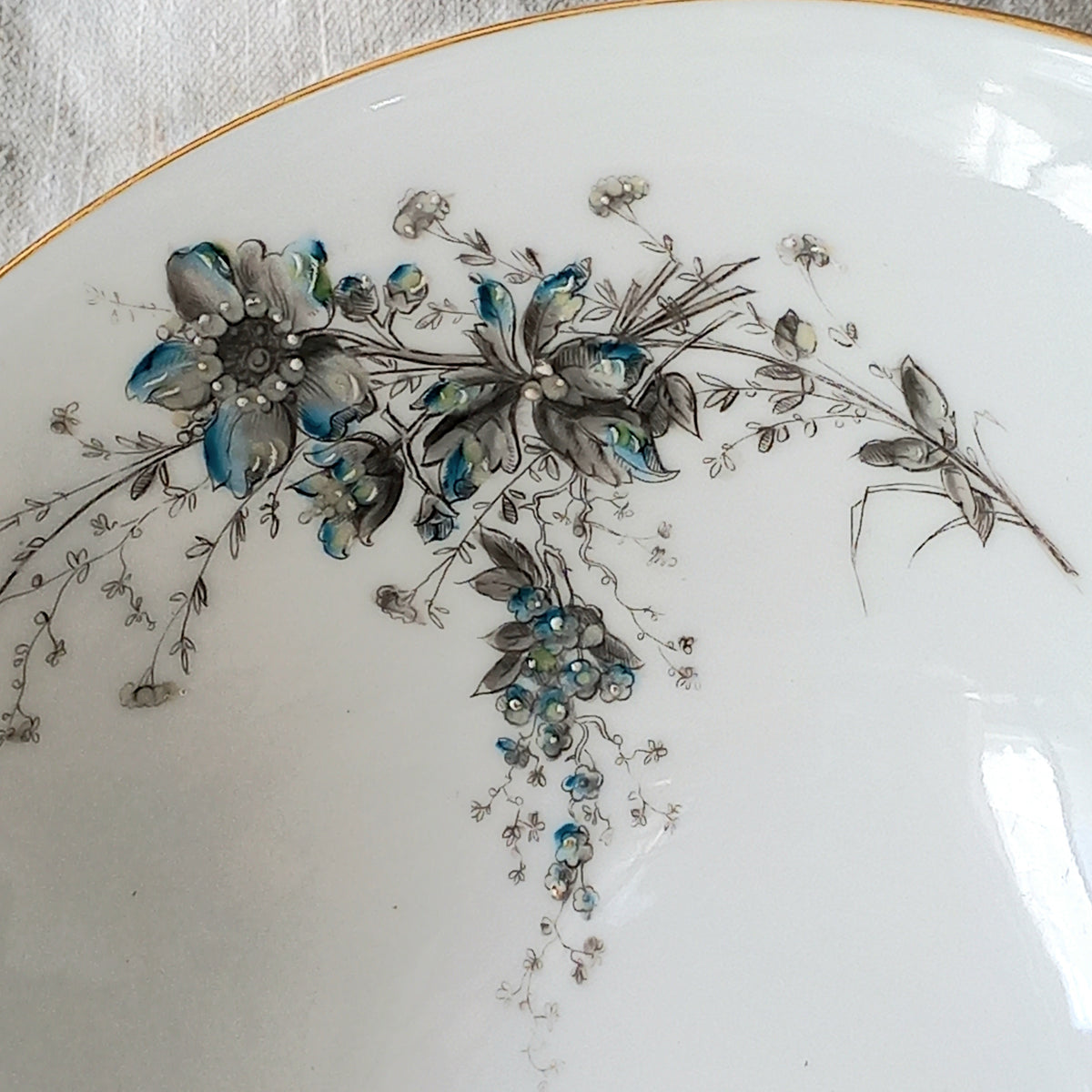 Stunning vintage porcelain compote purchased in south west France.

This beautiful piece is a quality 'footed' fruit bowl with a good weight and absolutely gorgeous floral and butterfly decoration with hand-painted details in relief.