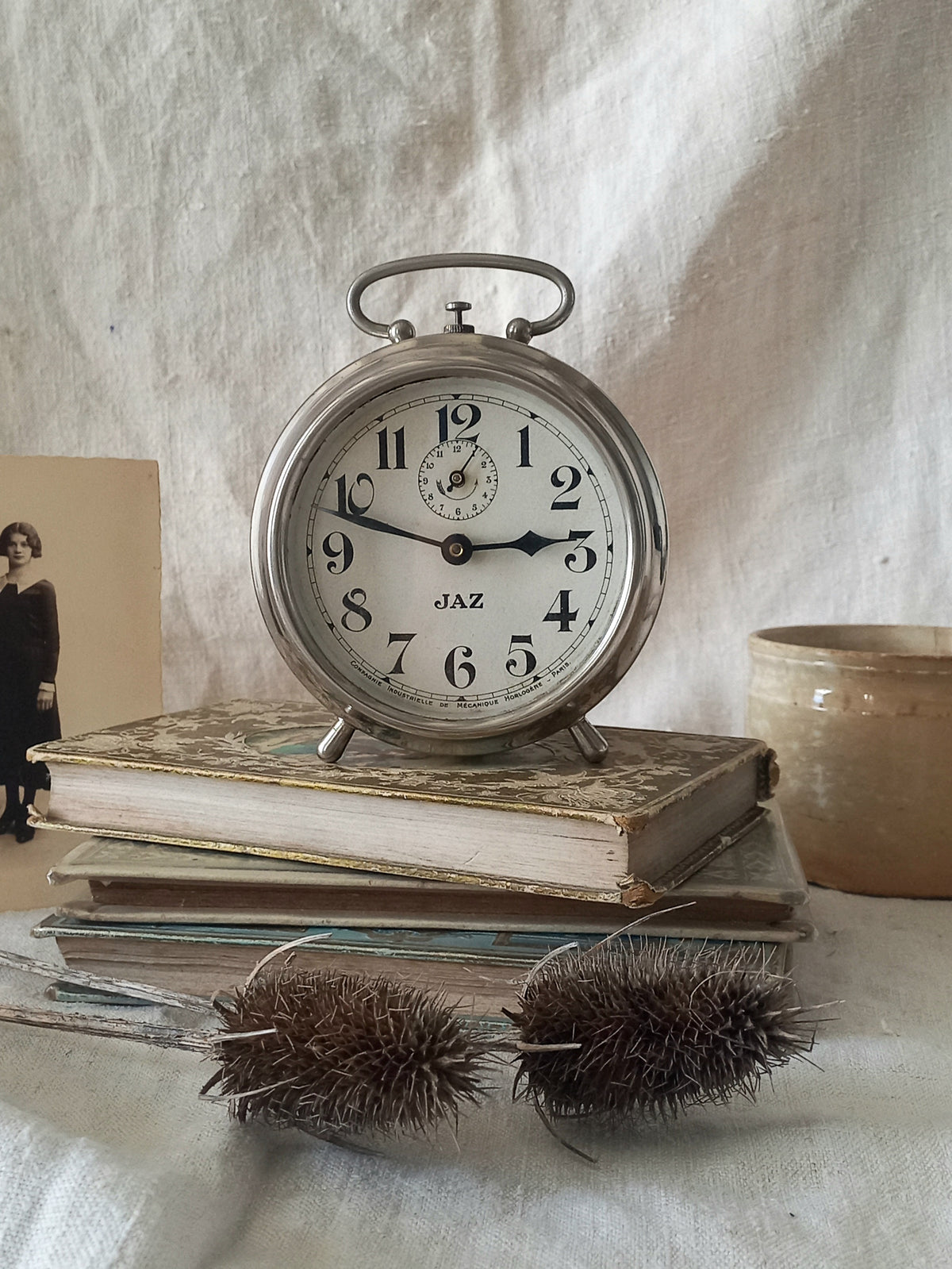 Original vintage Jaz alarm clock on books with a rustic background