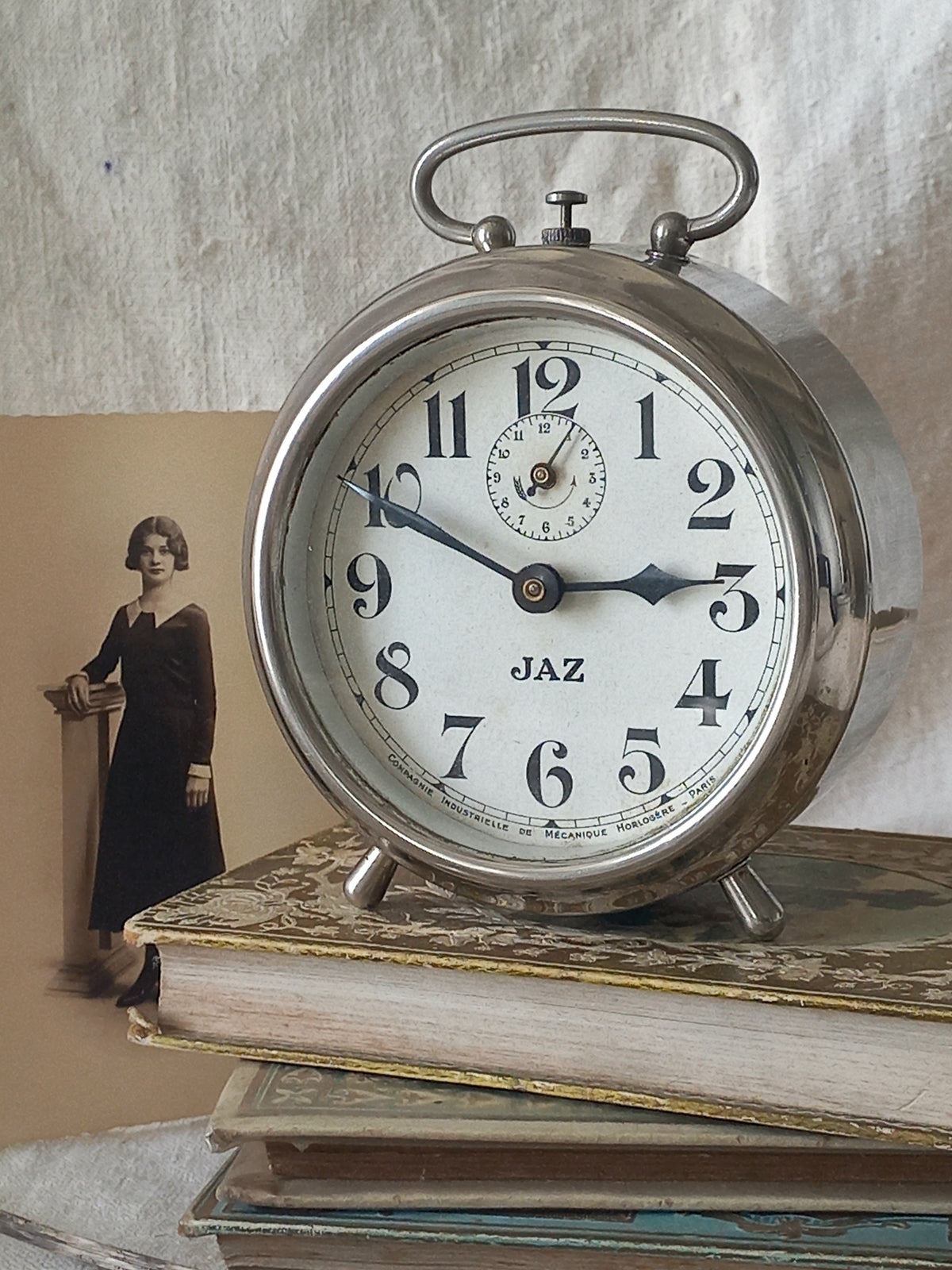 Original vintage Jaz alarm clock on books with a rustic background