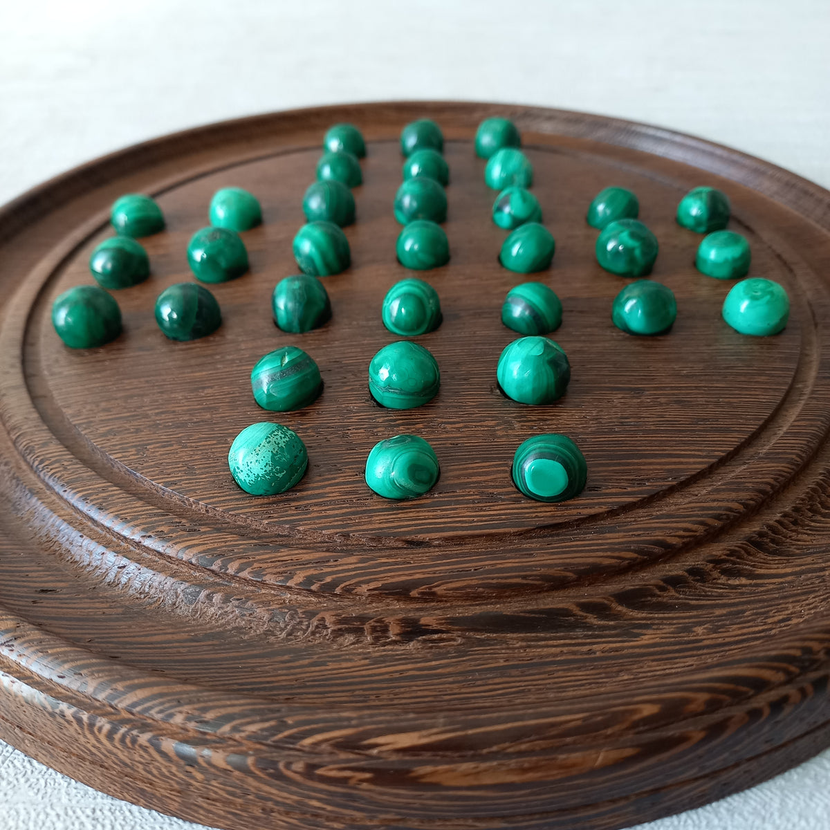 A beautiful French vintage solitaire board game with hand made hardwood base and 33 semi precious malachite stone marbles. This lovely old game also makes a wonderful piece of home decor.