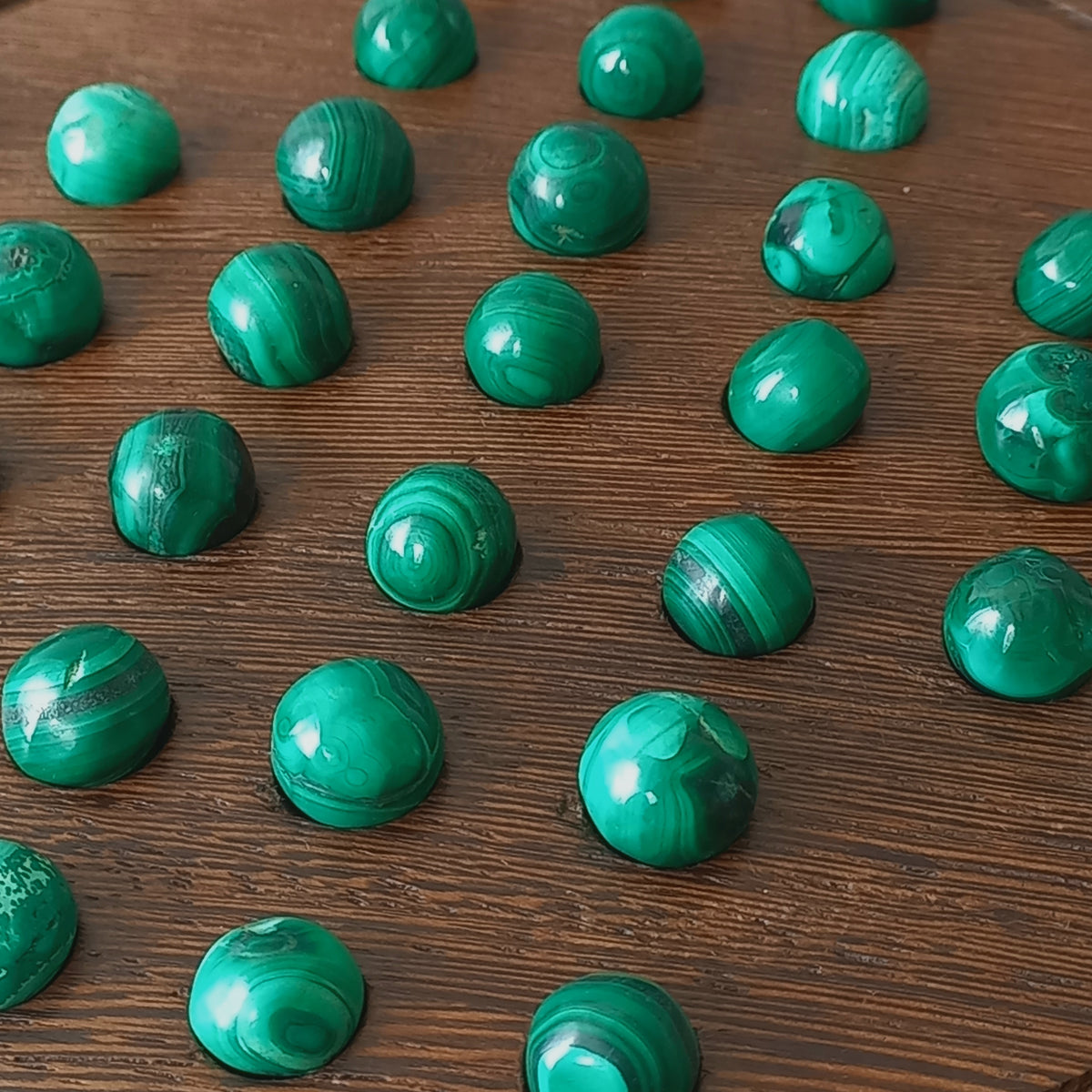 A beautiful French vintage solitaire board game with hand made hardwood base and 33 semi precious malachite stone marbles. This lovely old game also makes a wonderful piece of home decor.