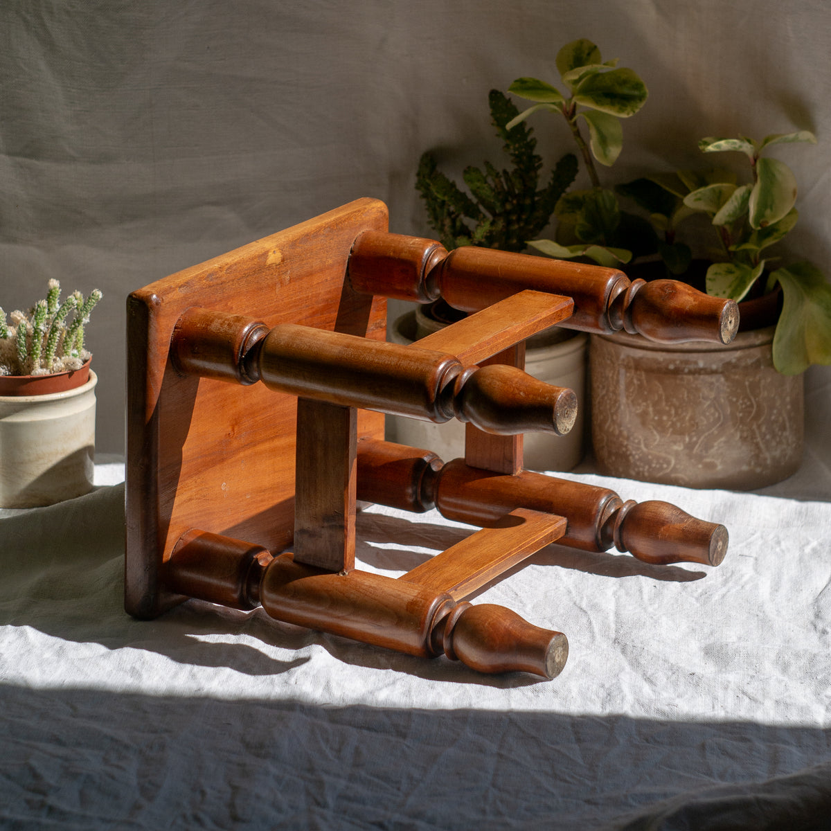 A handsome vintage French wooden stool in a lovely shade of honey-coloured brown. This old stool is very solid and would make a great plant stand (we currently use one on our desk as a plant stand and it looks great!) and many other decorative possibilities.