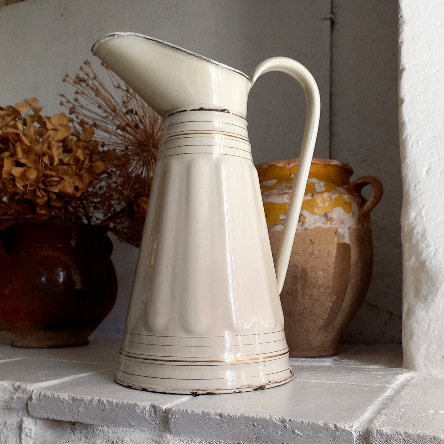 Large antique enamel pitcher in antique cream color with gold trim from France, large enamel jug, country kitchen and farmhouse decor